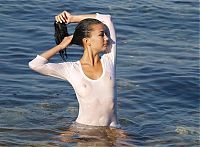 Nake.Me search results: black haired girl undresses her white wet shirt in the sea